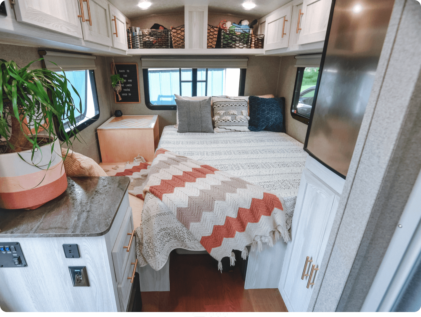 RV interior showcasing personal effects coverage with laptops, gear, and camping equipment